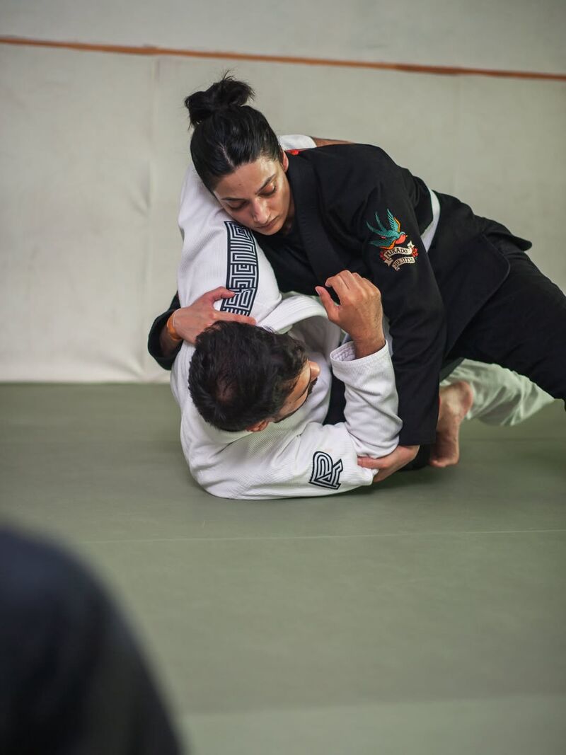 Two women sparring in the gi